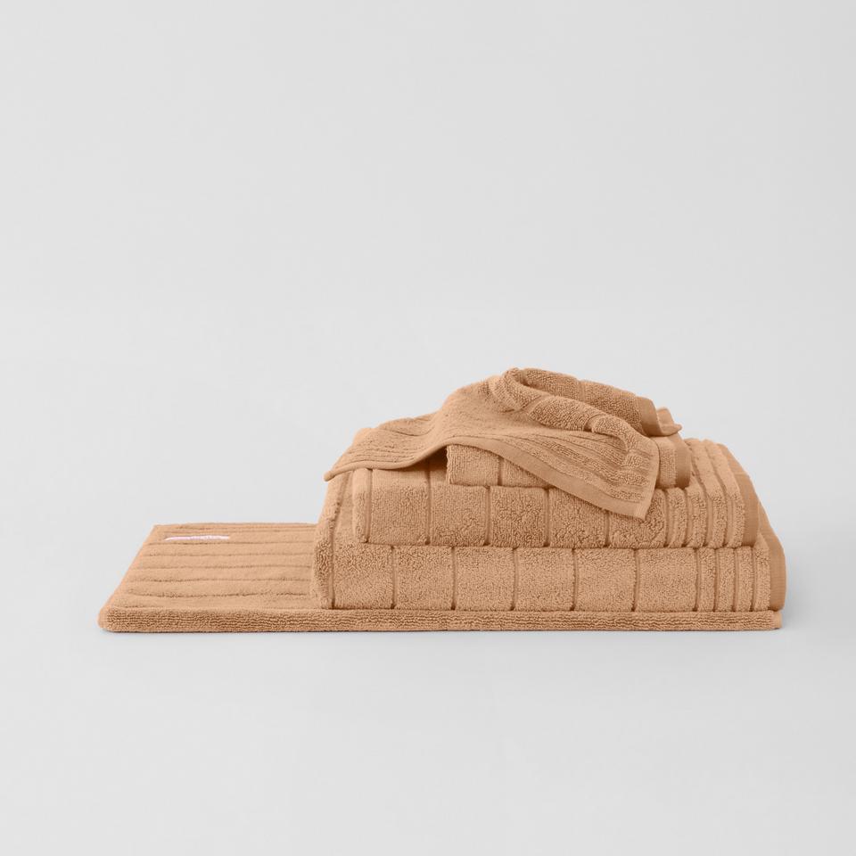 Orson Towel Range in Peach Sand